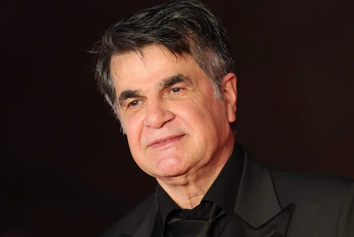 Jafar Panahi, the acclaimed filmmaker, looking serious and pensive.