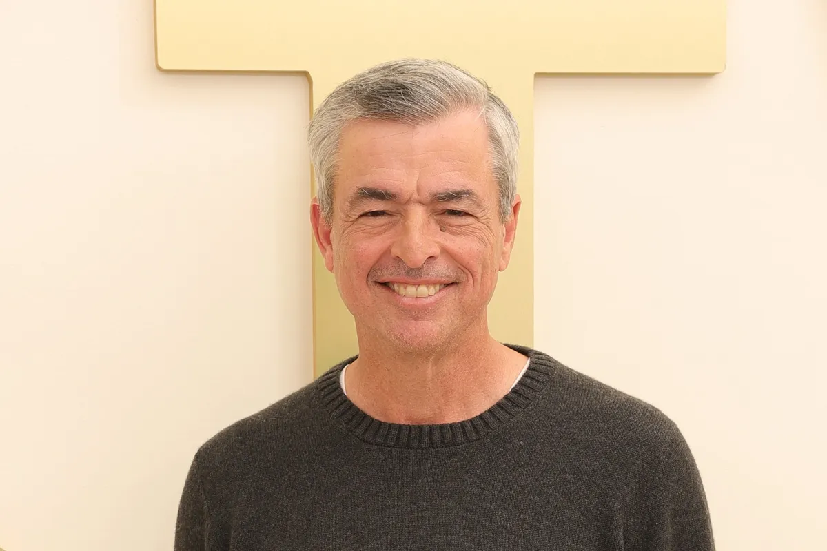 Eddy Cue, Senior Vice President at Apple, smiling and speaking on stage.