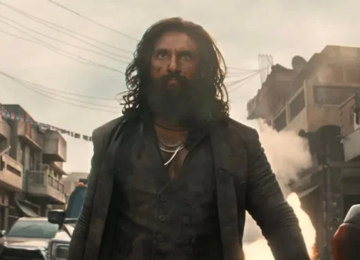 A dramatic movie poster for Dhurandhar 2 with intense colors and lead characters.