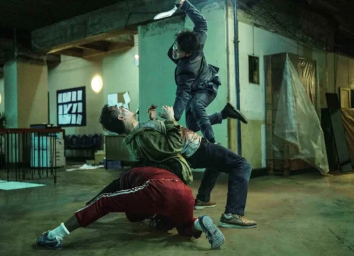 Martial artists engaged in a dynamic, high-flying fight sequence from 'The Furious' movie.