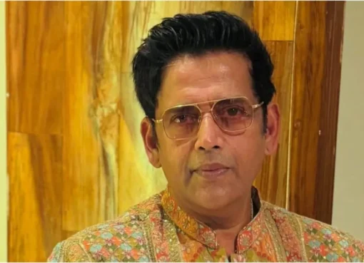 Ravi Kishan smiling on a stage.