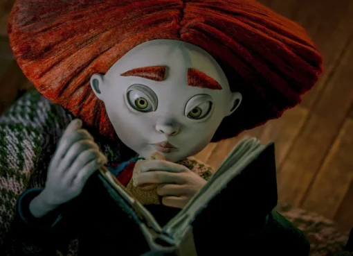 Matiss Kaza and Sofia Carrillo smiling together, perhaps with a stop-motion puppet.