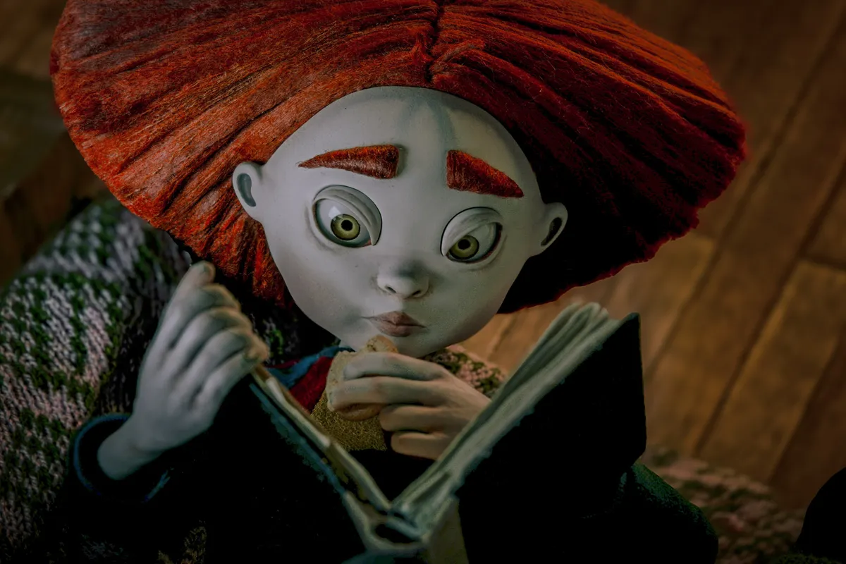 Matiss Kaza and Sofia Carrillo smiling together, perhaps with a stop-motion puppet.