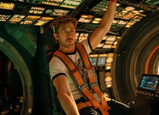 An astronaut in a spacesuit floating in space with a distant planet and stars in the background.