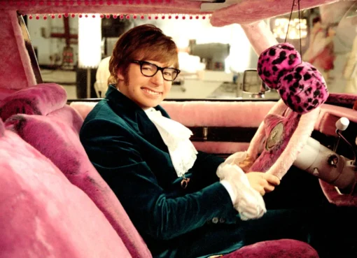 Mike Myers smiling while talking to fans at an event