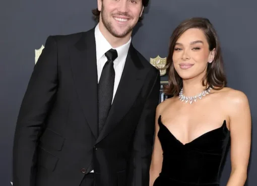 Hailee Steinfeld and Josh Allen smiling together, looking happy and relaxed.