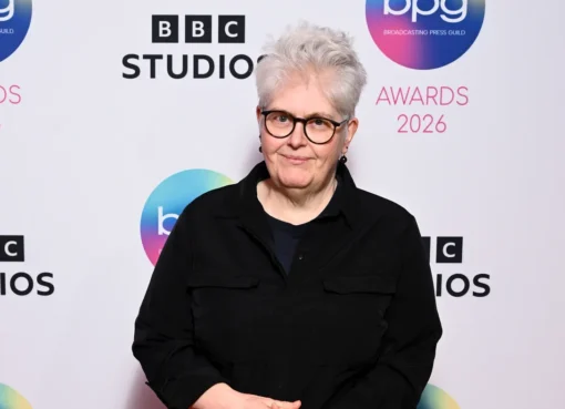 Sally Wainwright smiling brightly at a public event.