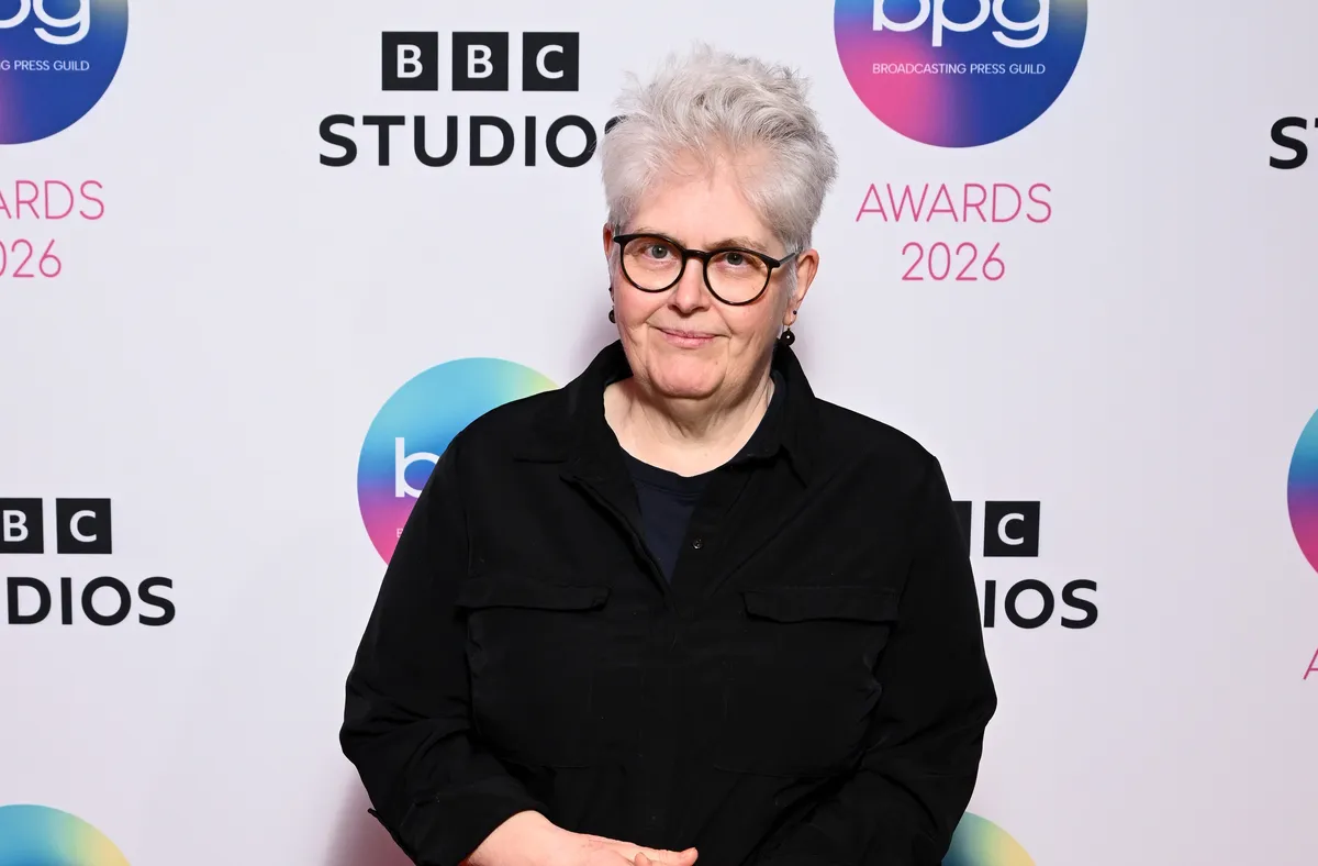 Sally Wainwright smiling brightly at a public event.