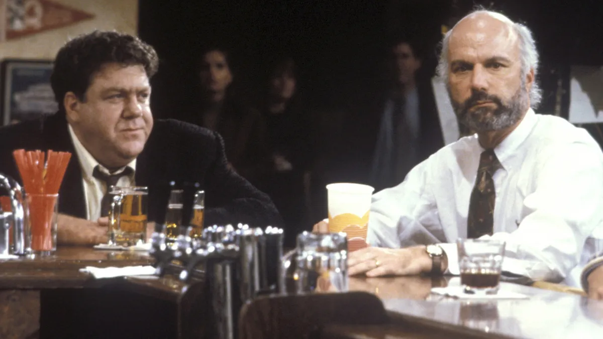 A photo of James Burrows directing a TV show.