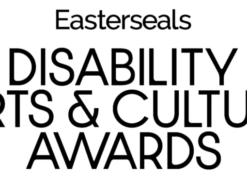 A stage with a spotlight, featuring the Easterseals and HRTS logos for the Darcy Awards.