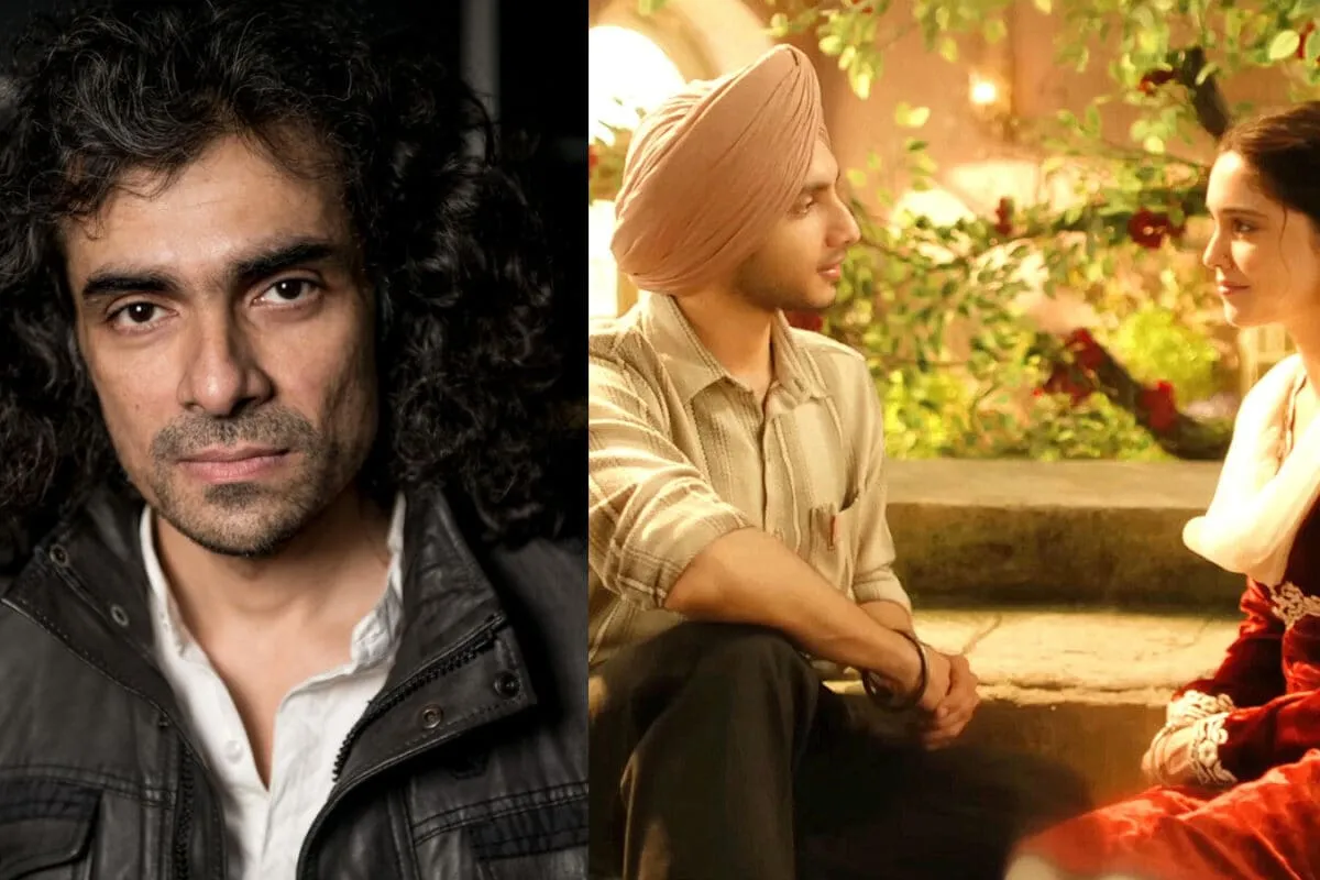 Director Imtiaz Ali smiling and waving to a crowd of fans inside a cinema hall.
