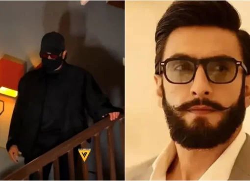 Ranveer Singh walking quickly with his face obscured near an office building.