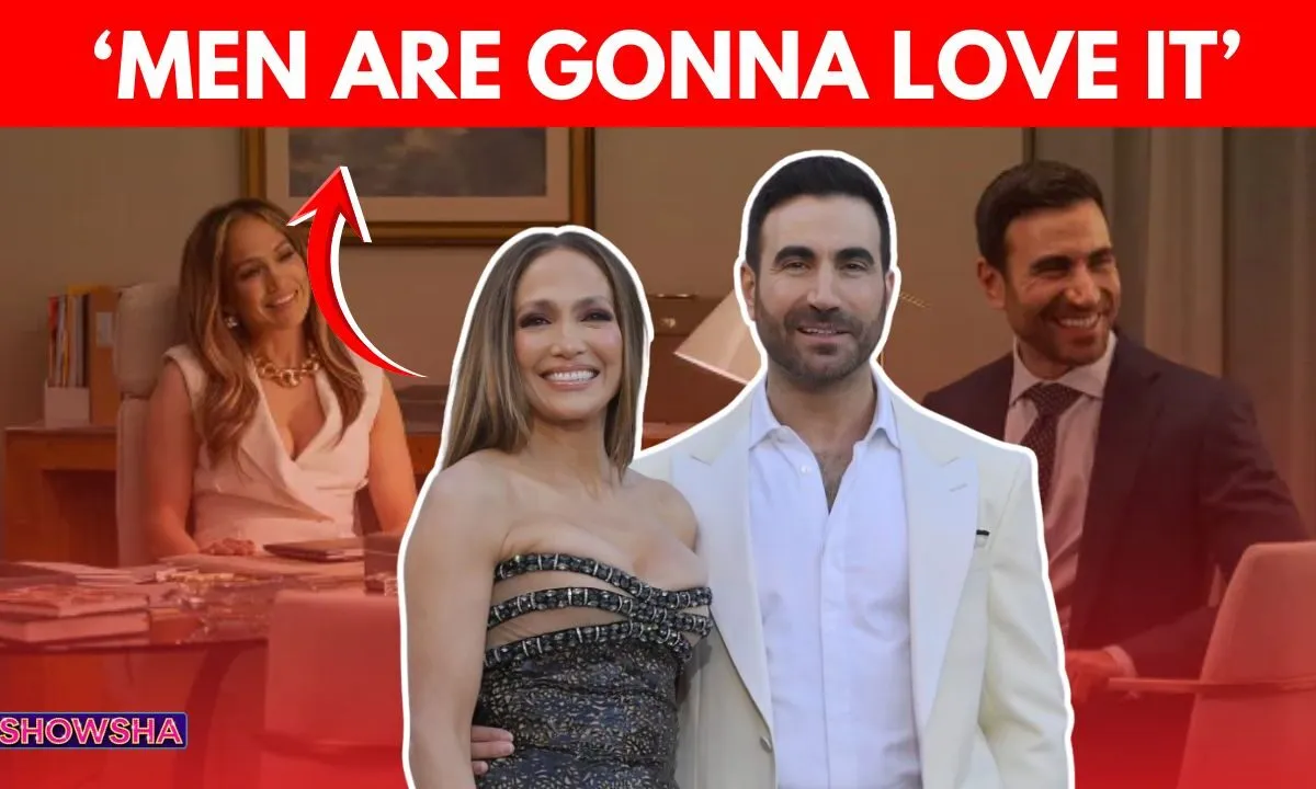 Jennifer Lopez and Brett Goldstein laughing during a press interview.