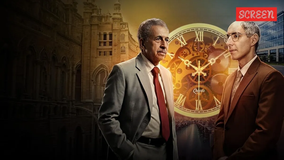 Jim Sarbh and Naseeruddin Shah looking at watch components.