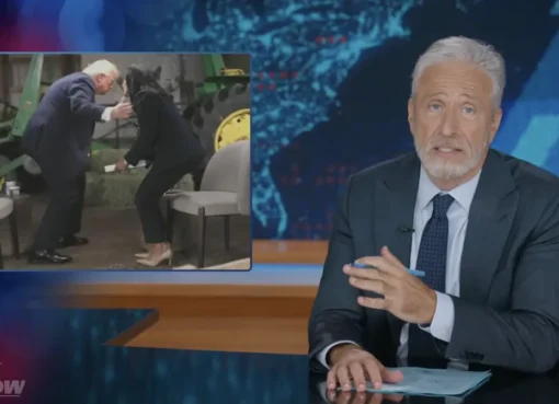 Jon Stewart laughing on the set of the Daily Show