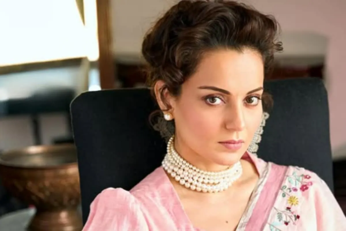 Kangana Ranaut in a light-colored outfit, speaking seriously about her film role.