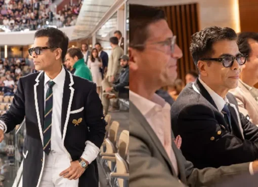 Karan Johar sitting courtside at Roland-Garros tennis tournament.