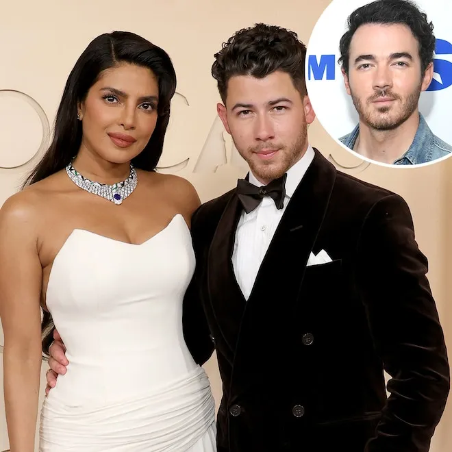 Kevin Jonas laughing with Nick Jonas and Priyanka Chopra at an event