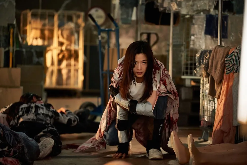 A movie poster for the Korean film 'Colony' showing a tense scene.