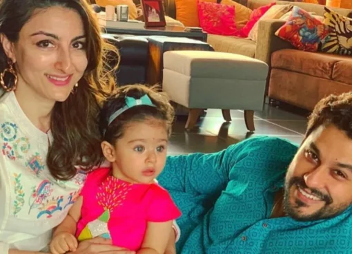Kunal Kemmu and Soha Ali Khan with their daughter Inaaya, smiling together.
