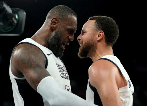 LeBron James and Stephen Curry smiling together during a basketball game