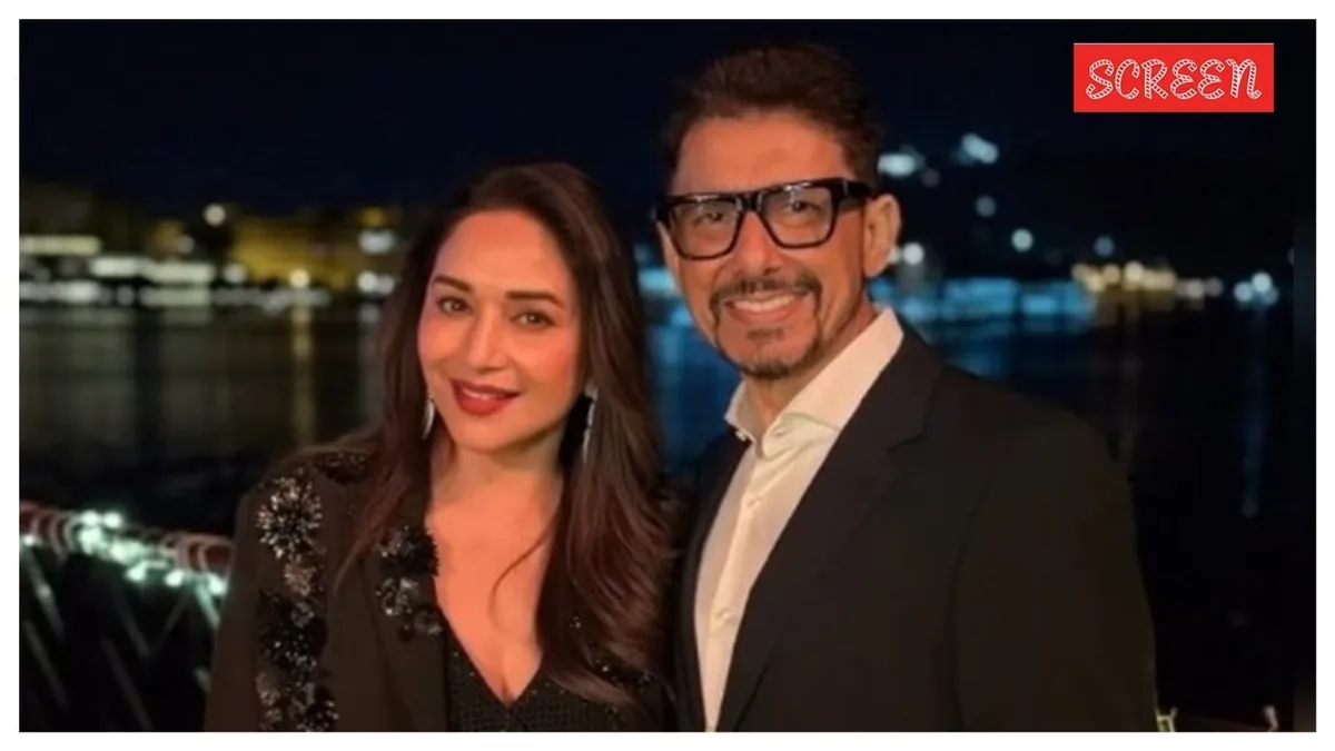 Madhuri Dixit and Shriram Nene smiling together at an event