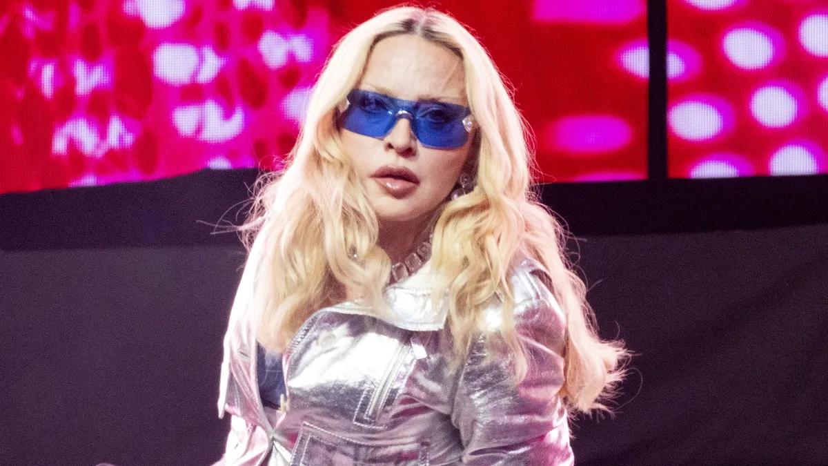 Madonna with a bold, artistic expression, perhaps with a natural element like a leaf or flower motif in the background.