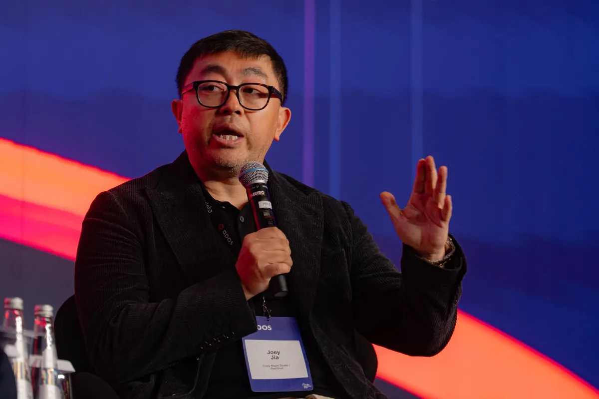 Joey Jia, CEO of Crazy Maple Studio and founder of ReelShort, speaking at a tech conference.