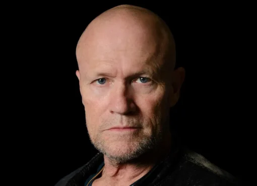 Michael Rooker looking intense in a character portrait.