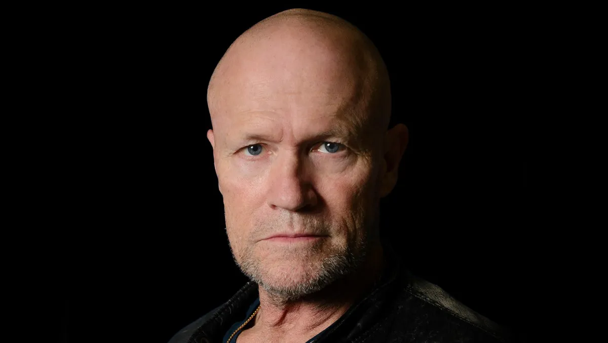 Michael Rooker looking intense in a character portrait.