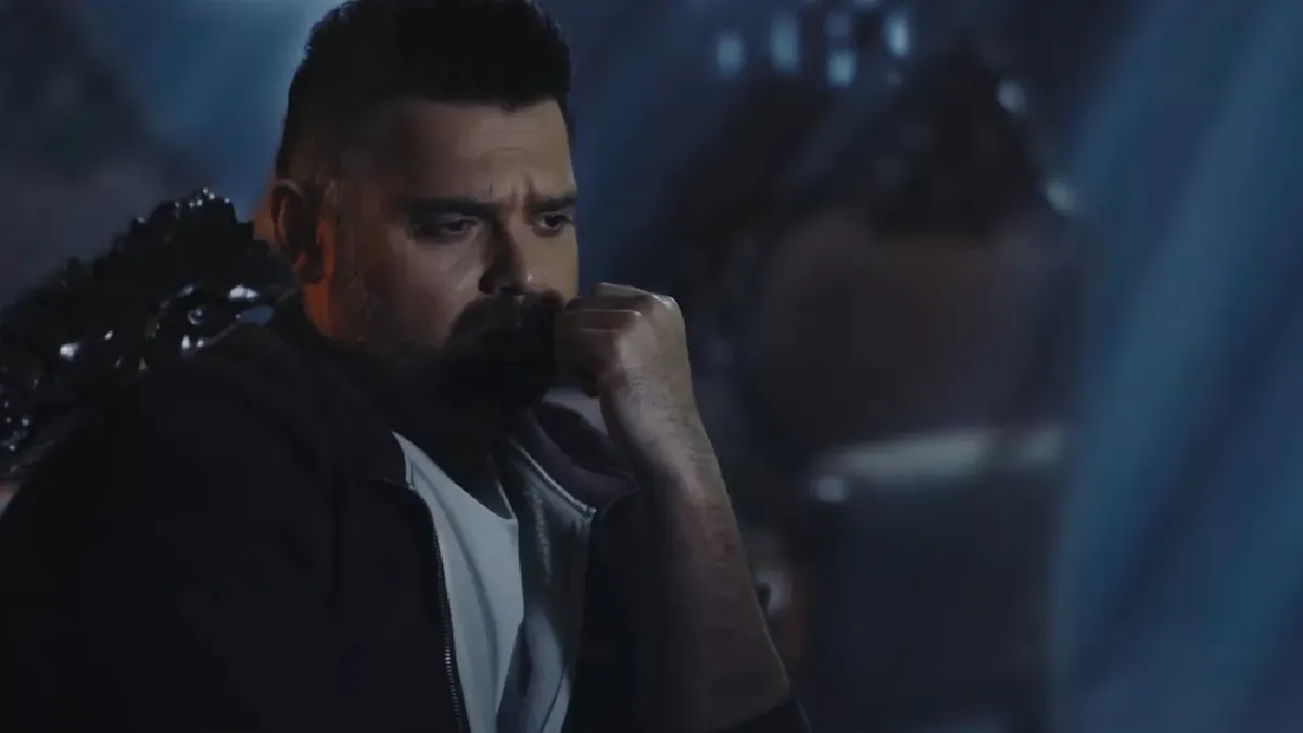 Mimoh Chakraborty looking worried in a dimly lit scene from Haunted 3D.