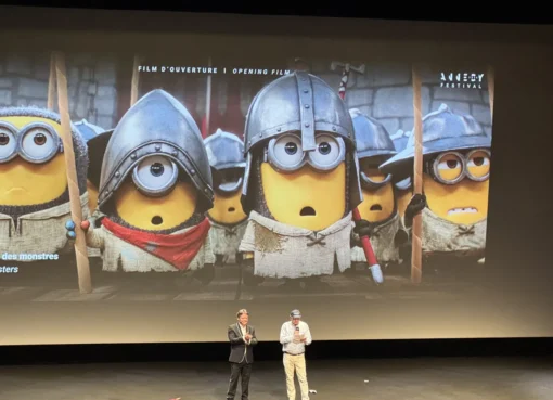 Animated Minions characters on a movie screen.
