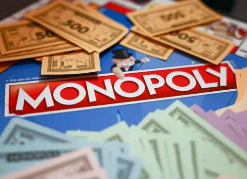 A Monopoly board game with properties and money.