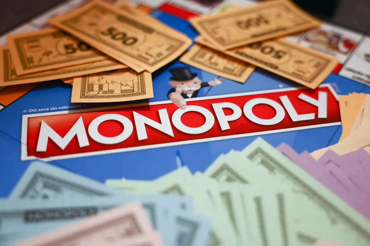 A Monopoly board game with properties and money.