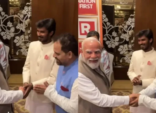Prime Minister Narendra Modi smiling and interacting with actors Ashok Pathak and Durgesh Kumar.