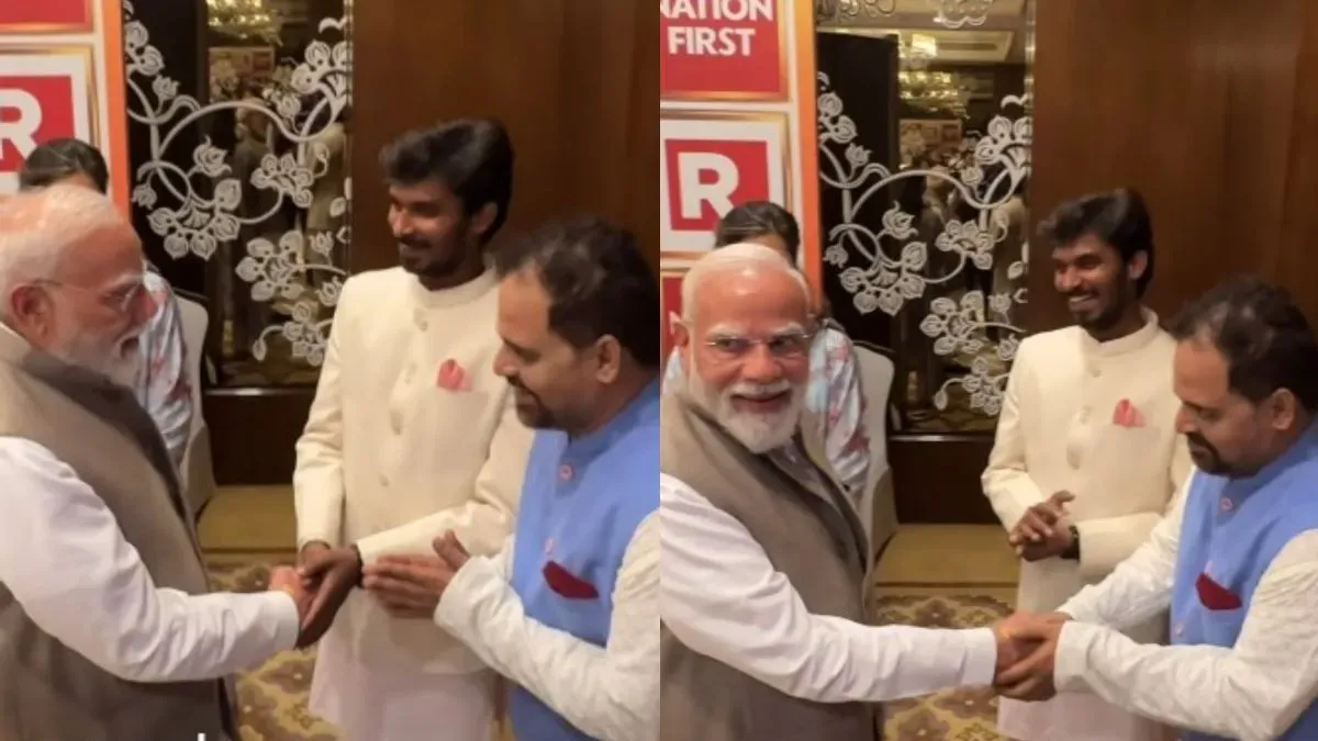 Prime Minister Narendra Modi smiling and interacting with actors Ashok Pathak and Durgesh Kumar.