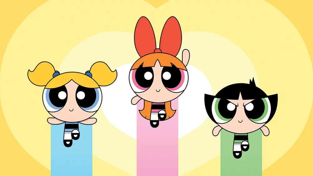 The Powerpuff Girls, Blossom, Bubbles, and Buttercup, in their signature flying pose above Townsville.