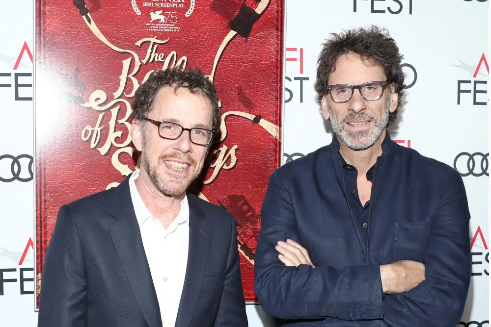 Joel and Ethan Coen smiling together warmly.