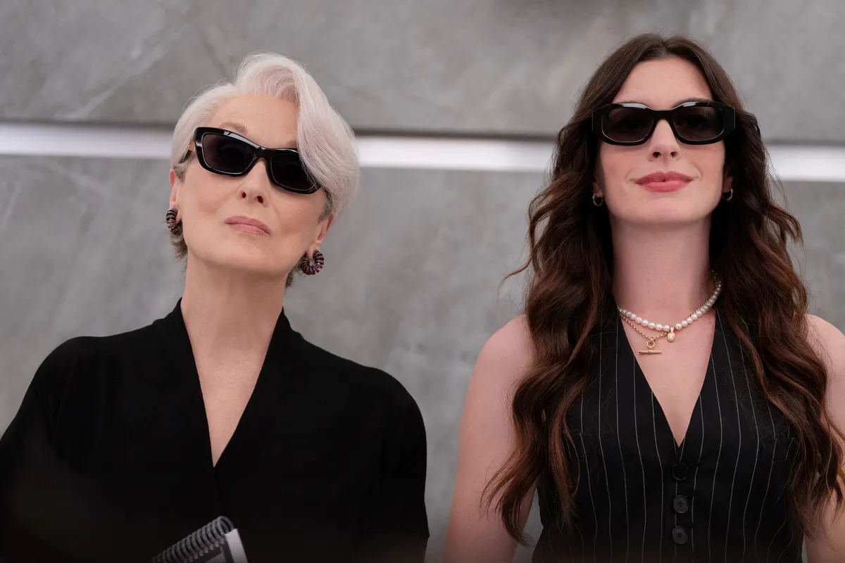 Still image from The Devil Wears Prada 2 showing a character in a stylish, powerful outfit.