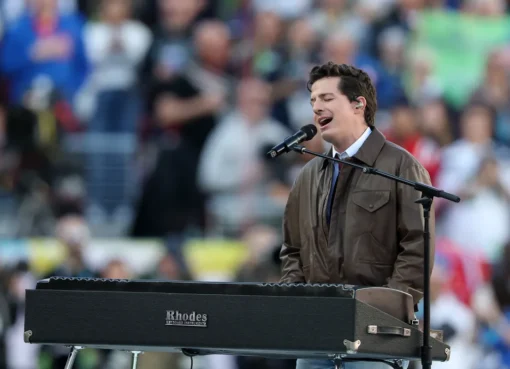 Charlie Puth looking sad on his phone