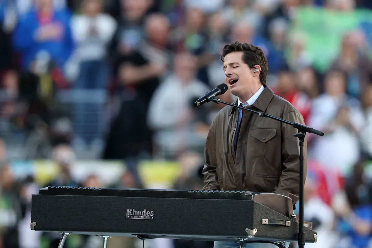 Charlie Puth looking sad on his phone