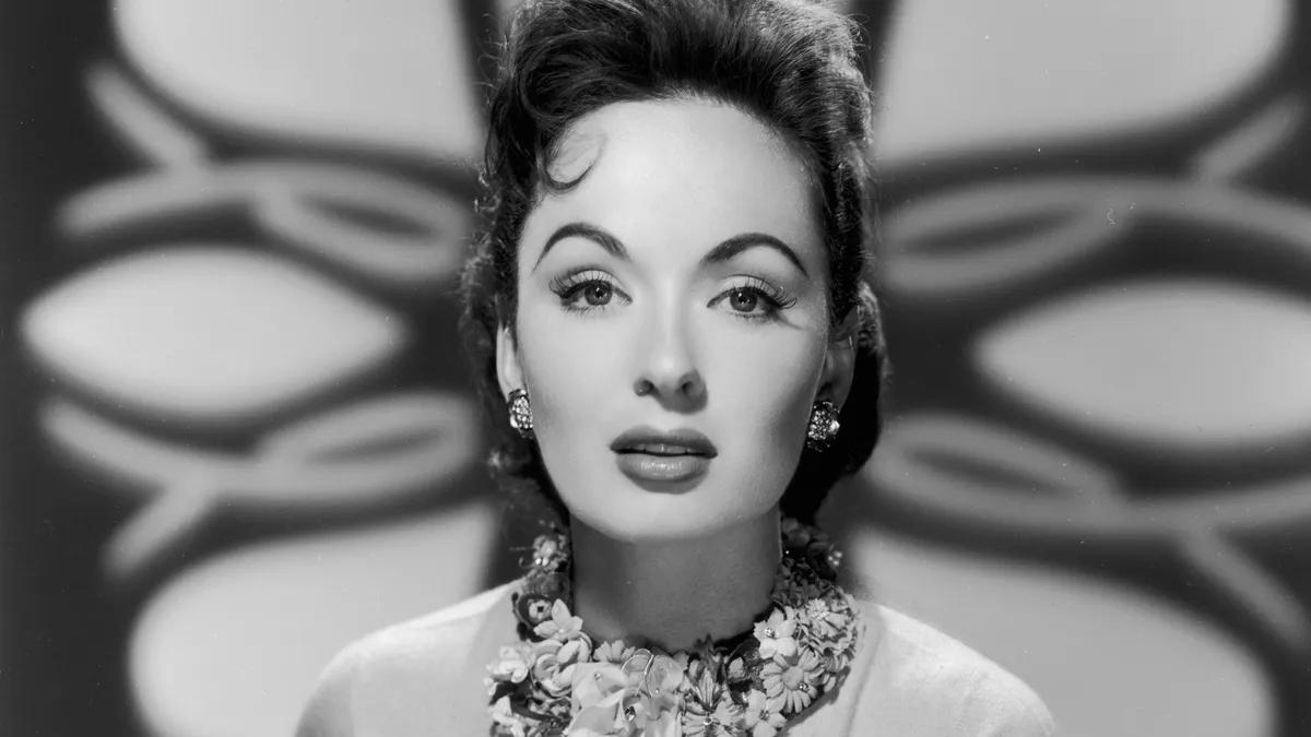 Black and white photo of Ann Blyth in a glamorous pose.