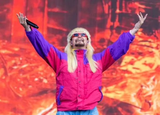 Oliver Tree in his signature bowl cut and oversized sunglasses, looking quirky and creative.