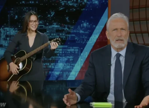 Olivia Munn appearing as a surprise guest on the set of The Daily Show with Jon Stewart.