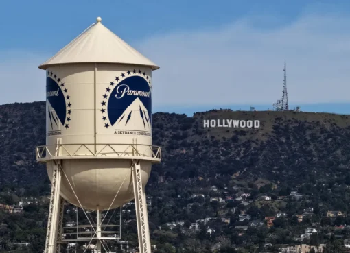 A graphic showing the logos of Paramount and Warner Bros. Discovery with a green checkmark.