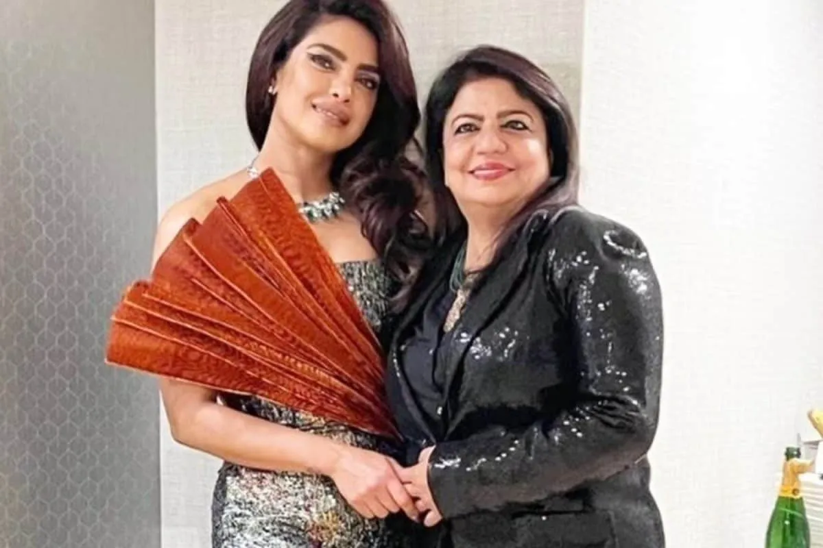 Priyanka Chopra and her mom Madhu Chopra smiling together in a warm photo.