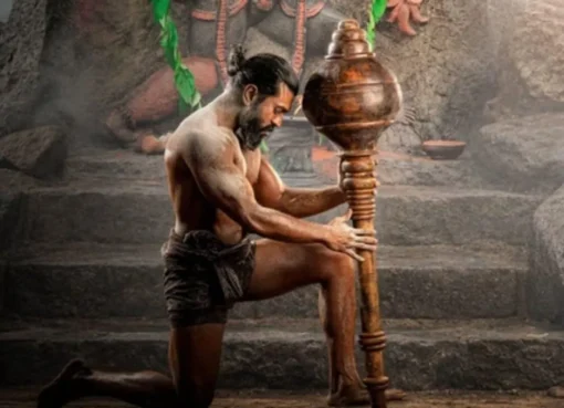 Movie poster with Ram Charan in action.