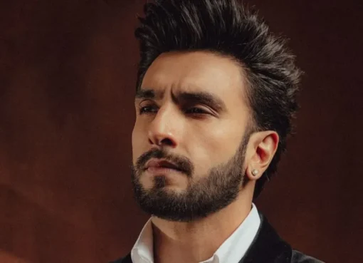 Ranveer Singh looking intense in a stylish outfit.