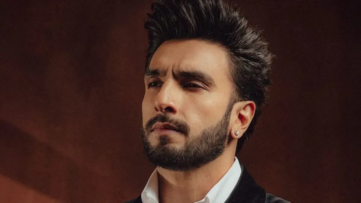 Ranveer Singh looking intense in a stylish outfit.