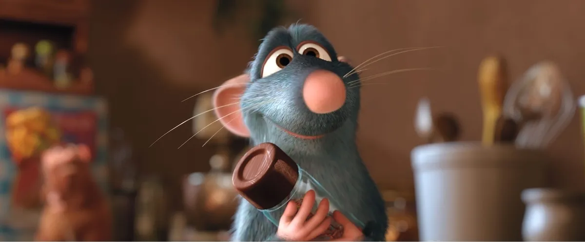 Patton Oswalt smiling, next to an image of Remy from Ratatouille.
